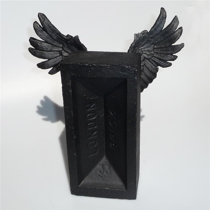 Front view of Winged Brick Sculpture (Black on Black)